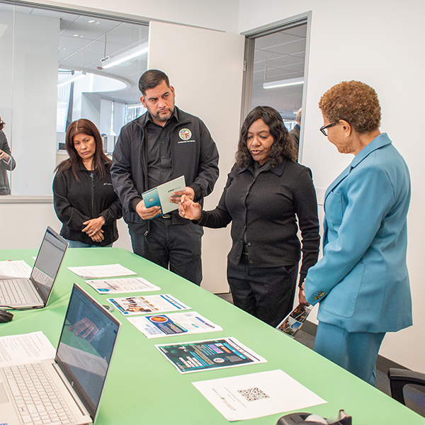 (right to left) Mayor Karen Bass, EWDD General Manager Carolyn Hull and District 13 Councilmember Hugo Soto-MartÃnez discuss available resources at the West LA Worker and Family Recovery Center